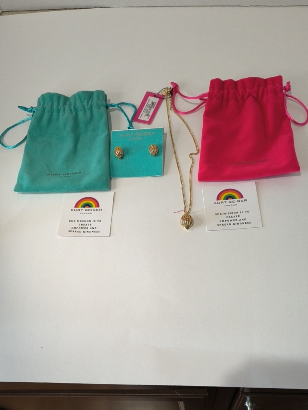 Kurt Geiger Gold Eagle HeadNecklace and Stud Earrings with Pink and Teal Pouches